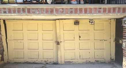 Before: old wooden barn garage door