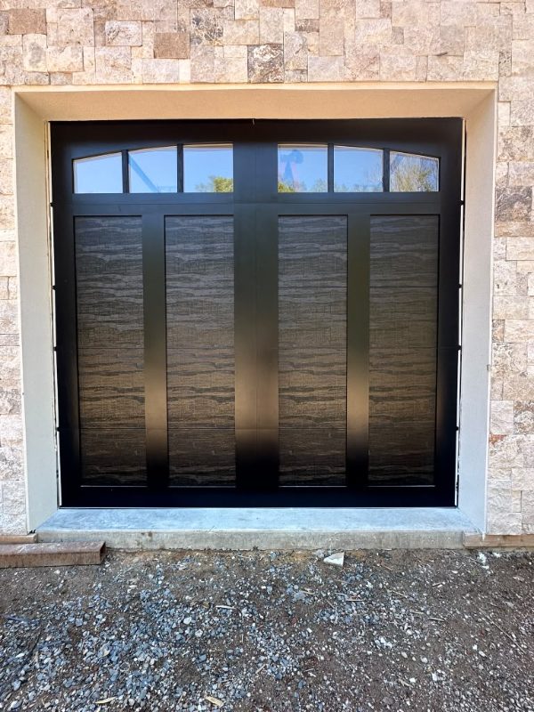 New black carriage-style garage door installed by J&C in Westchester