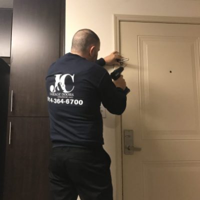 J&C technician installing a door lock
