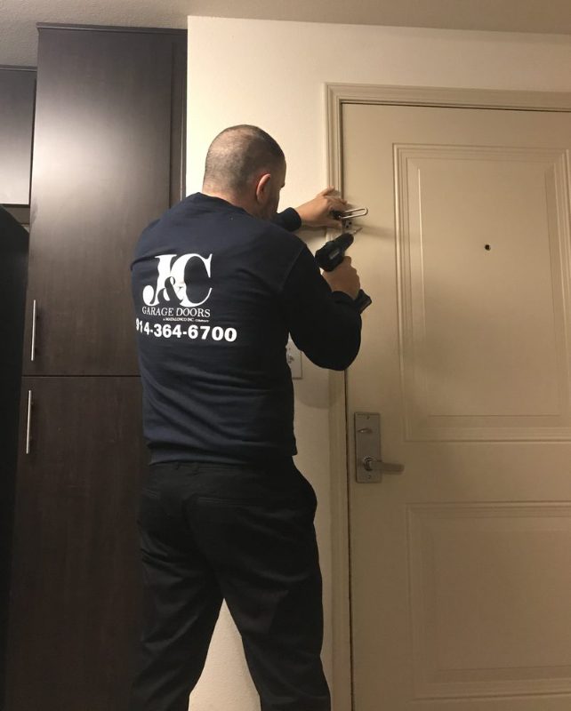 J&C technician installing a door lock in Westchester County